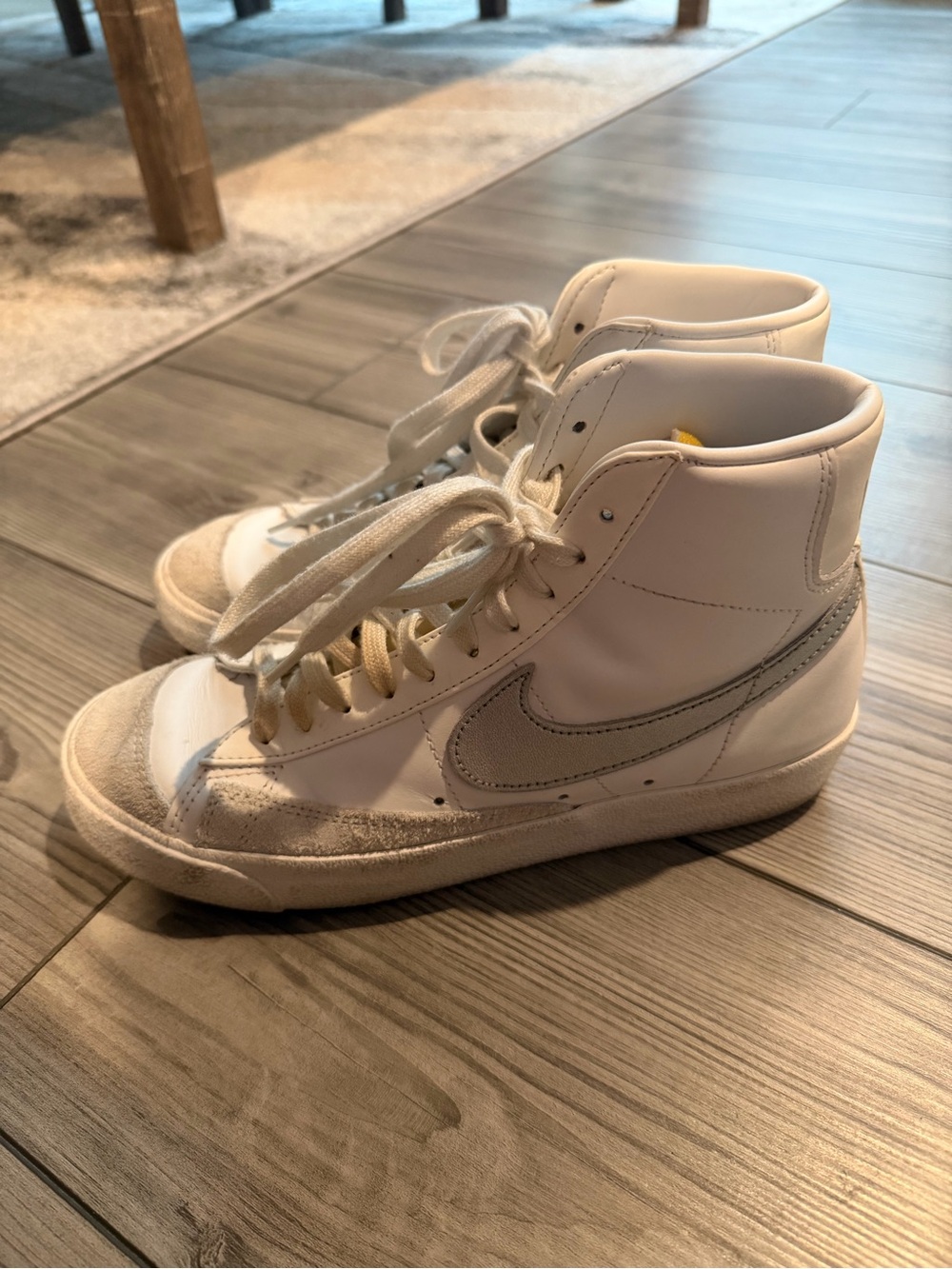 Nike White High-Top Sneakers with Gray Swoosh